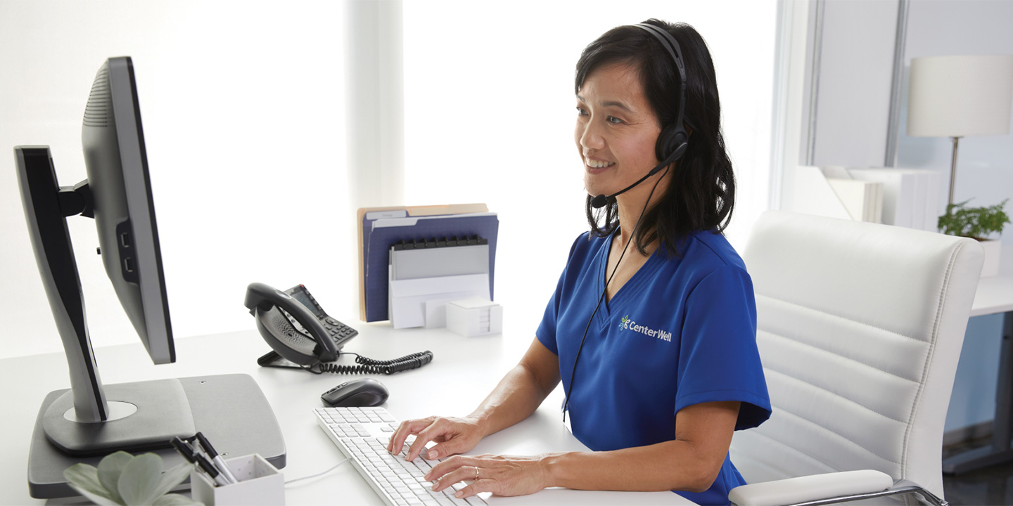 Female clinician happily receives patient calls at the office